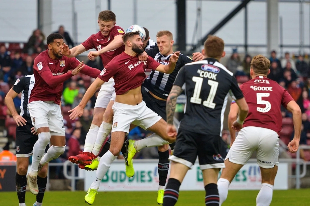 Grimsby town players in action against Northampton Town