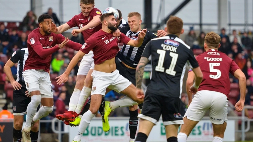 Grimsby town players in action against Northampton Town