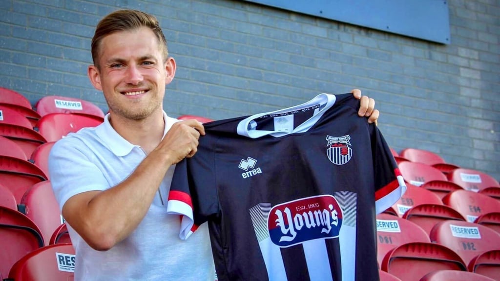Williams holding shirt
