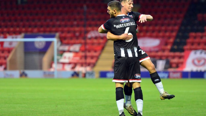 grimsby town players celebrating a goal