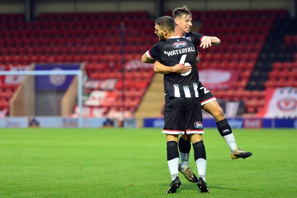 grimsby town players celebrating a goal