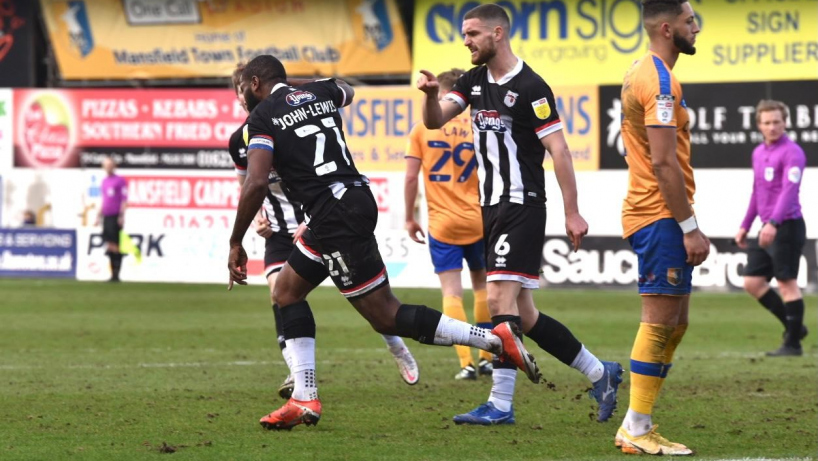 Grimsby town players celebrating a goal