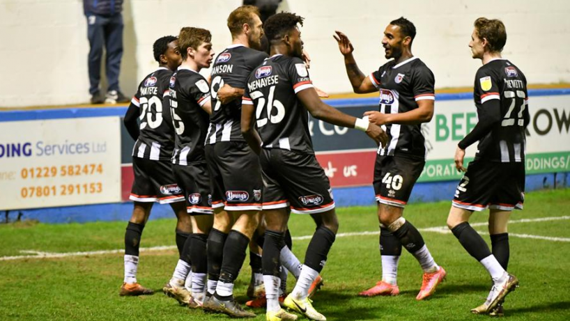 Grimsby town players in action