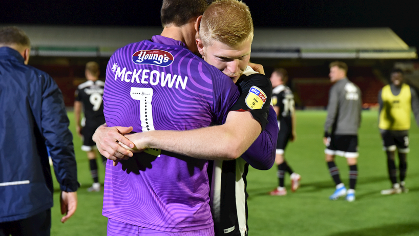 Grimsby town players embracing