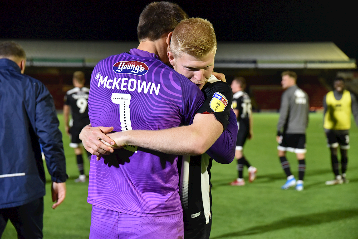 Grimsby town players embracing