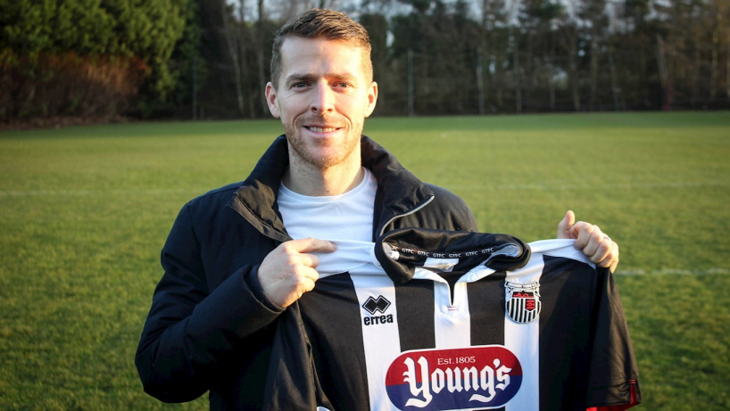 clarke holding his new GTFC shirt