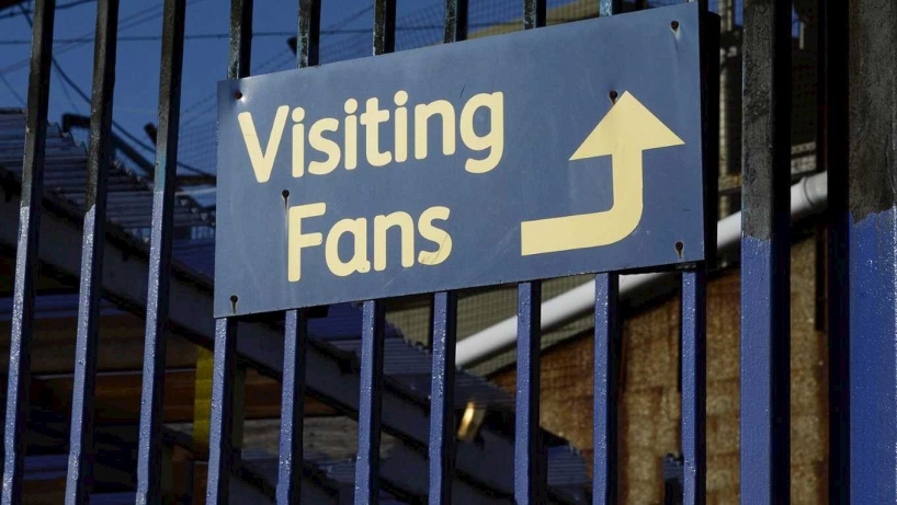 Visiting fans sign