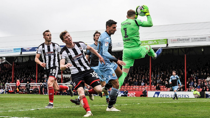 Grimsby town players in action