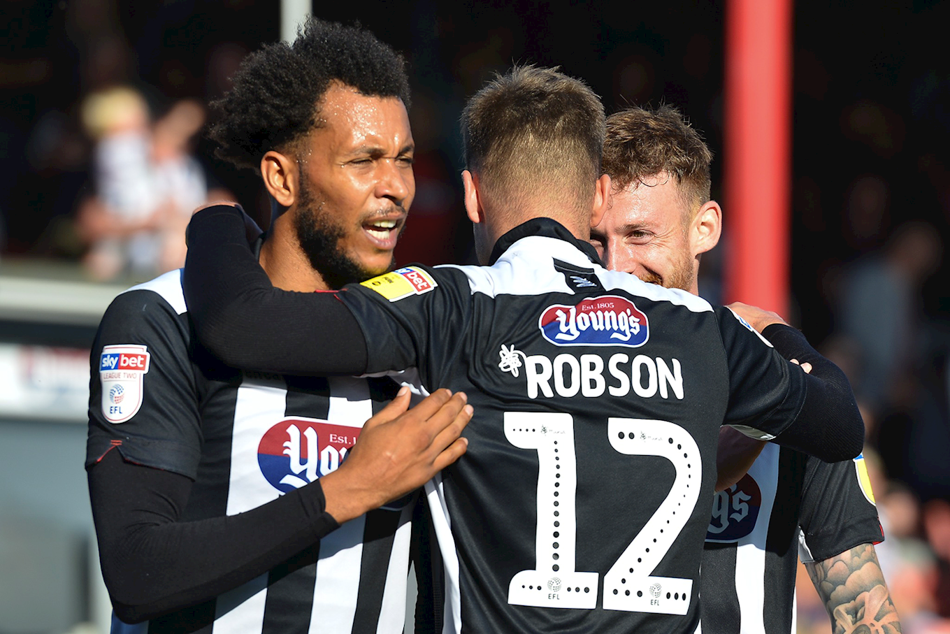 Grimsby town players celebrating a goal