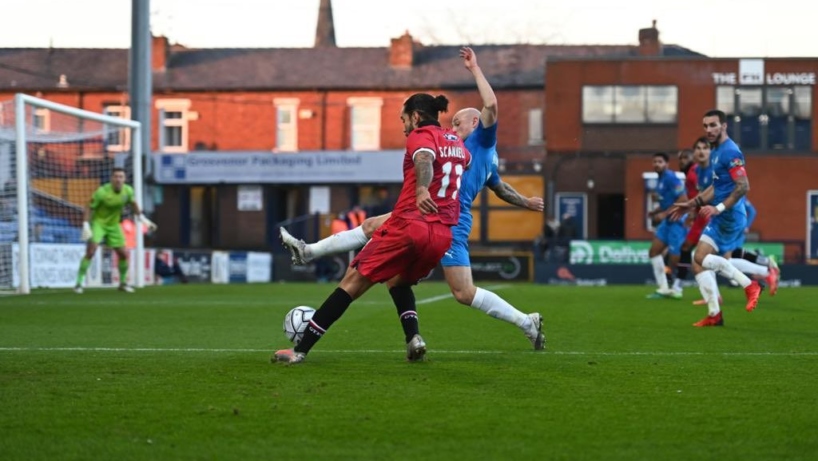 Grimsby Town players in action against Stockport