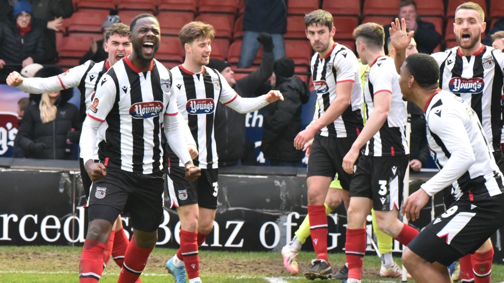 Town players celebrate Emmanuel Dieseruvwe's last minute winner