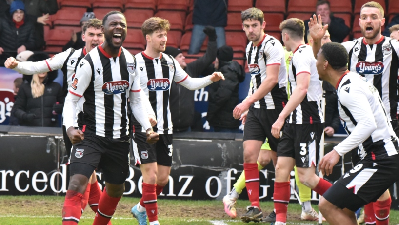 Town players celebrate Emmanuel Dieseruvwe's last minute winner