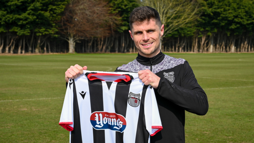 Gavan Holohan Holding a GTFC Shirt