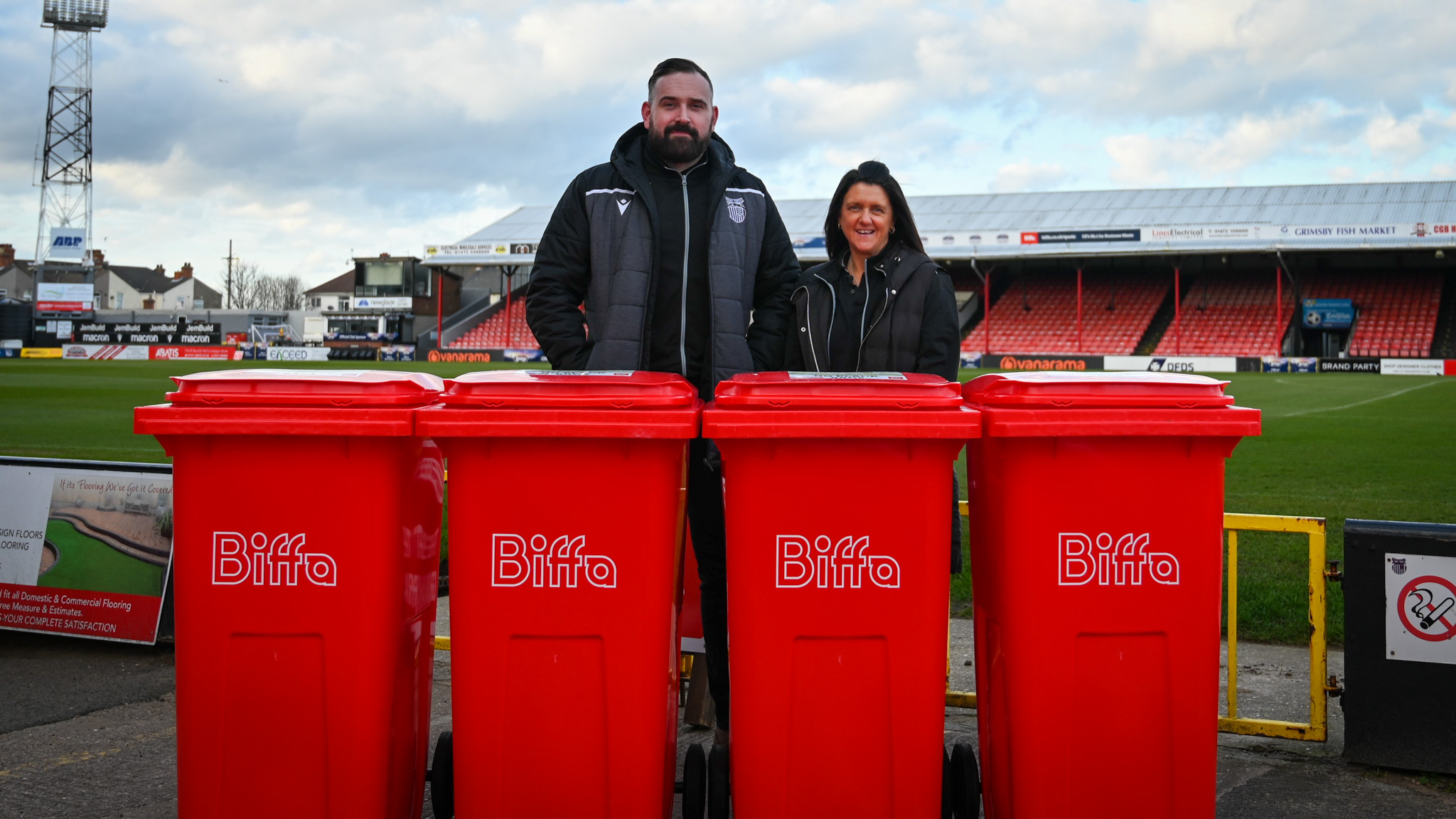 Grimsby Town Employees In Front Of New Recycling Bins