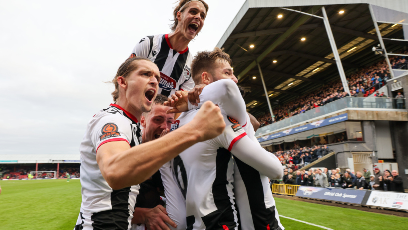 Grimsby Town FC players celebrate a goal