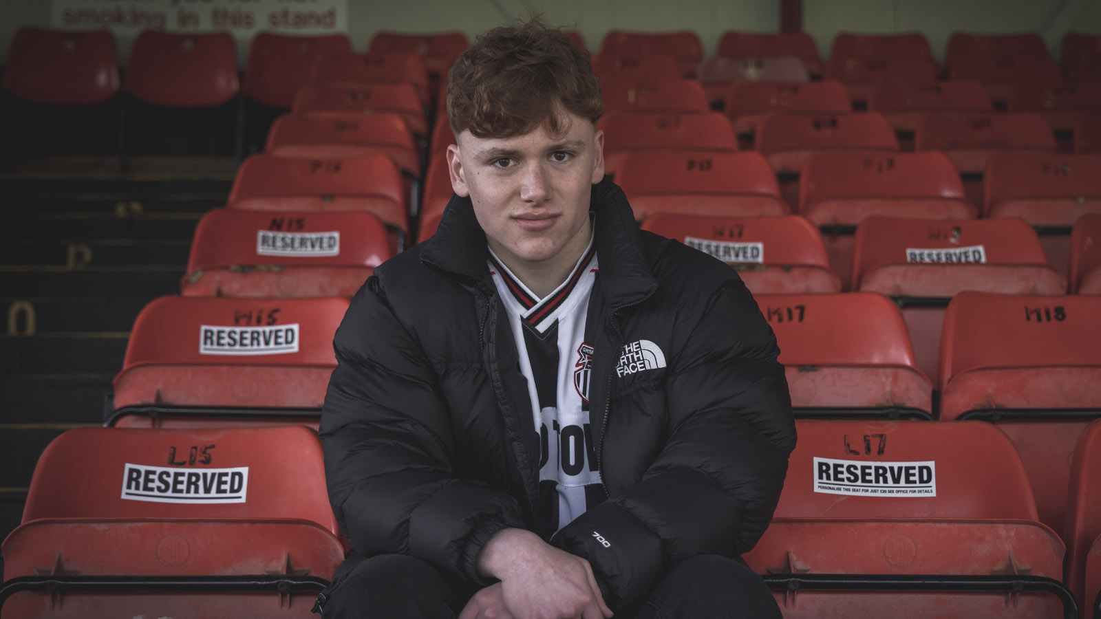Young fan sat in the stands at blundell park