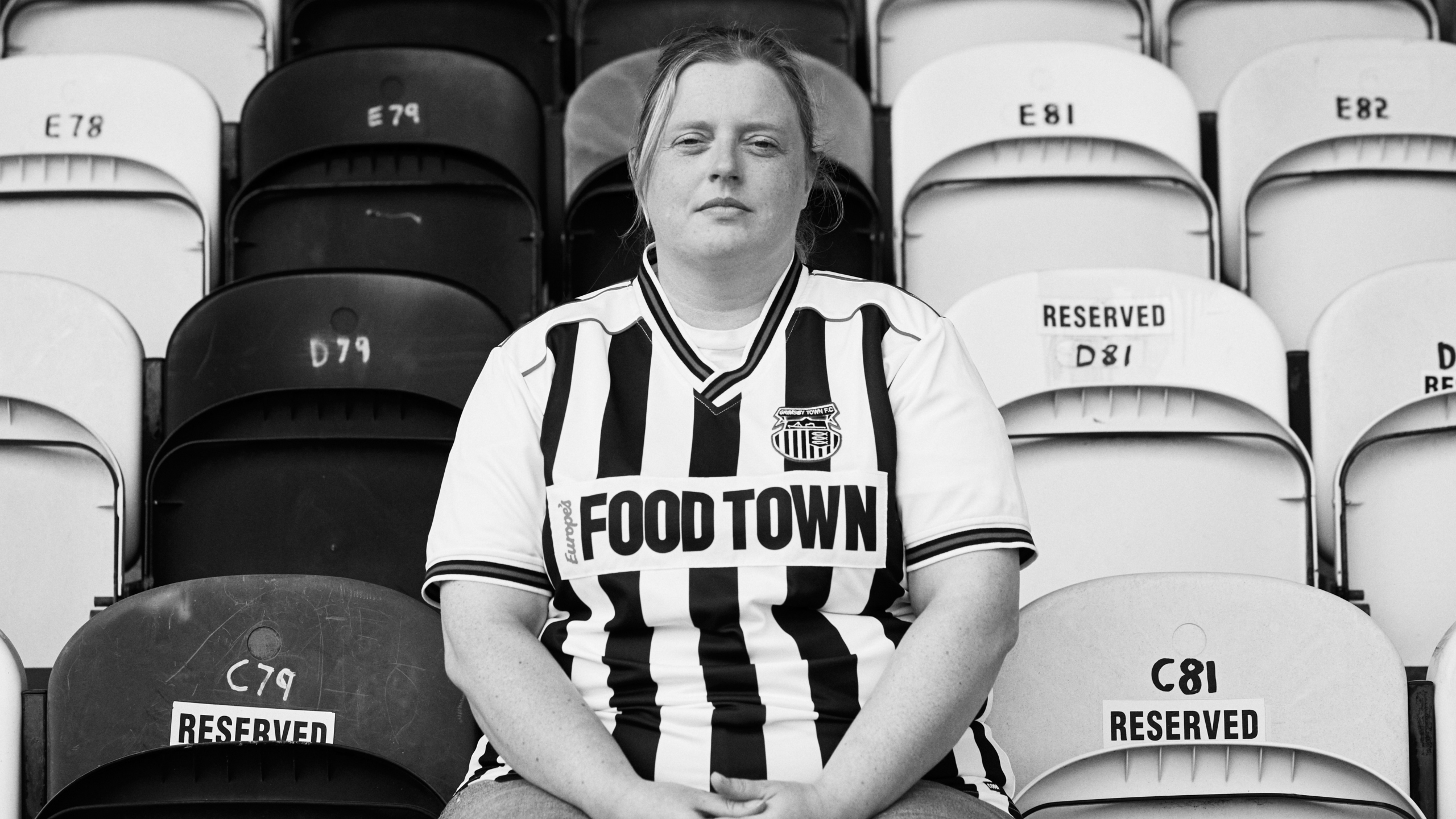Grimsby town fan sat in the stand at blundell park