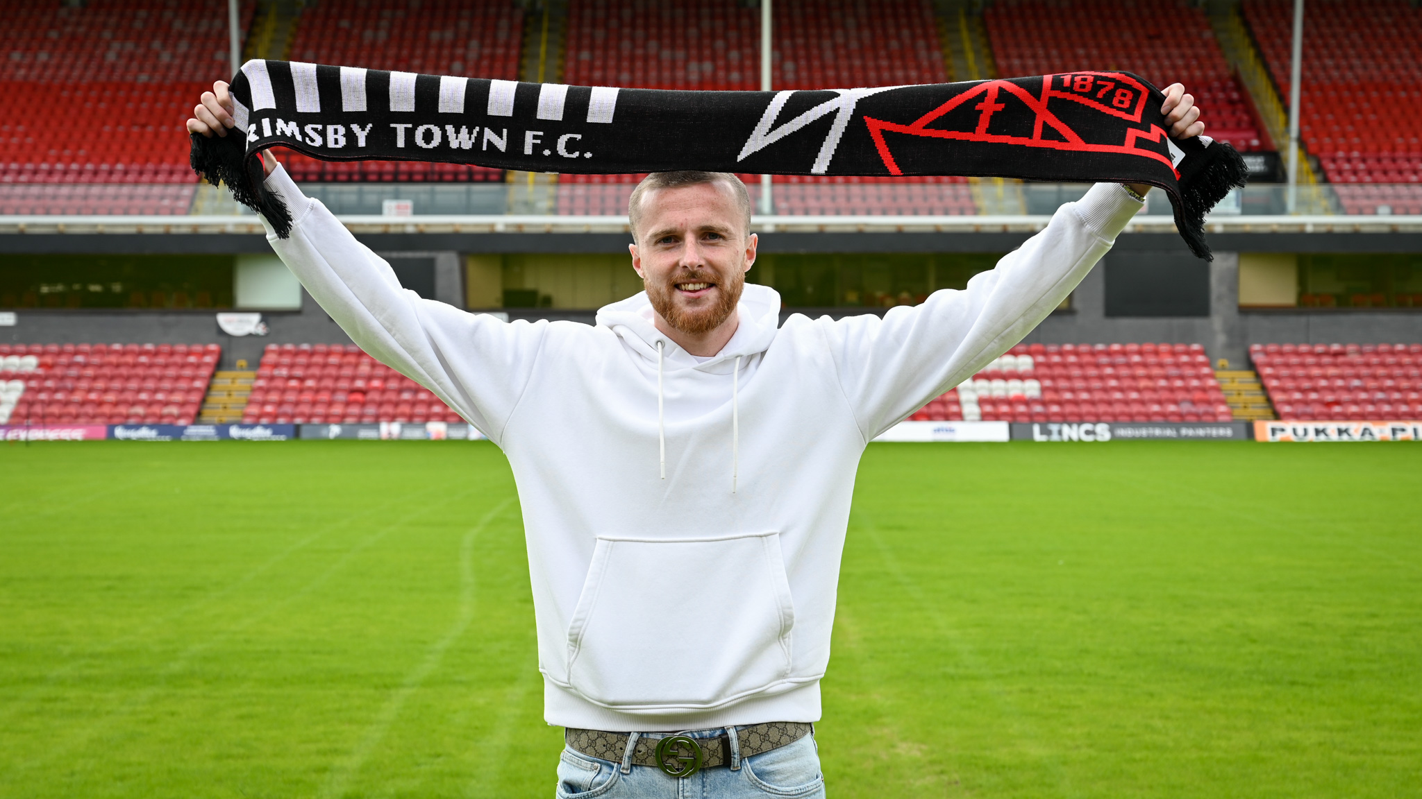 Niall Maher Holding A Scarf At Blundell Park