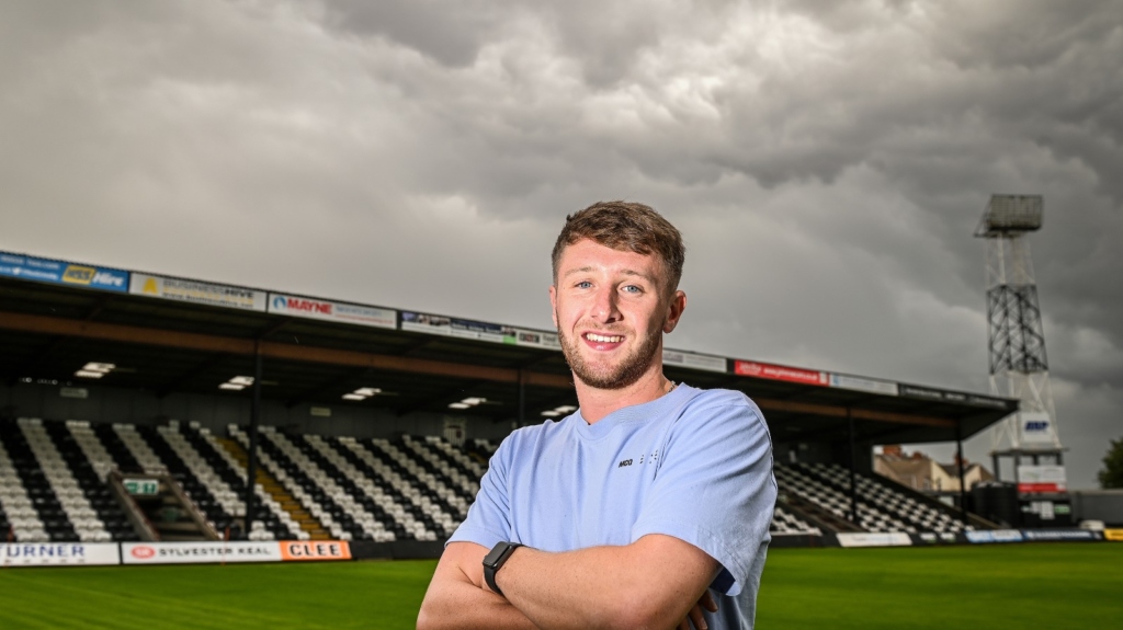 Wearne stood on the pitch at blundell park
