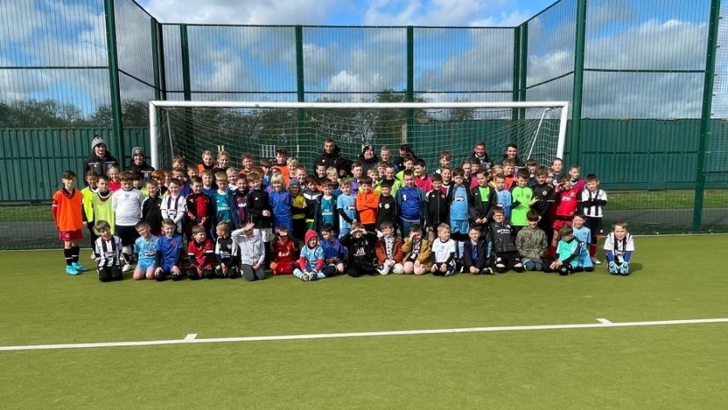 Group photo of kids after playing football