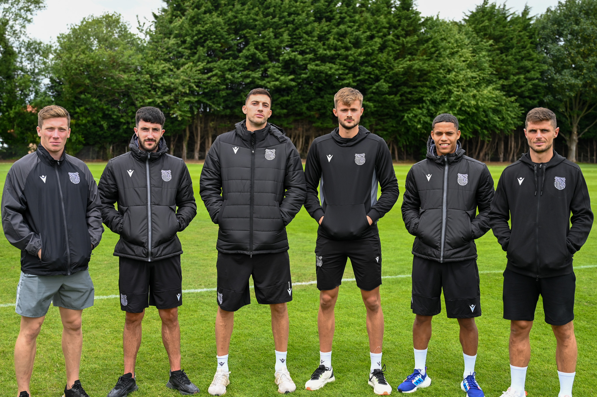 GTFC Players displaying a selection of our new 22/23 training and leisurewear