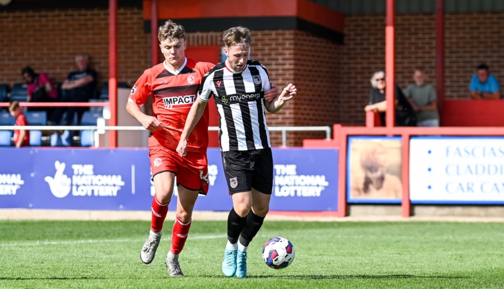 Grimsby Town football player in action against Alfreton Town