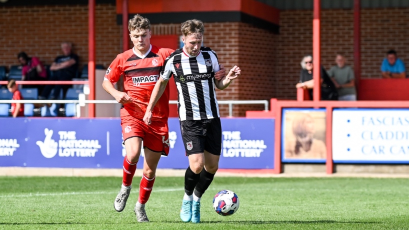 Grimsby Town football player in action against Alfreton Town