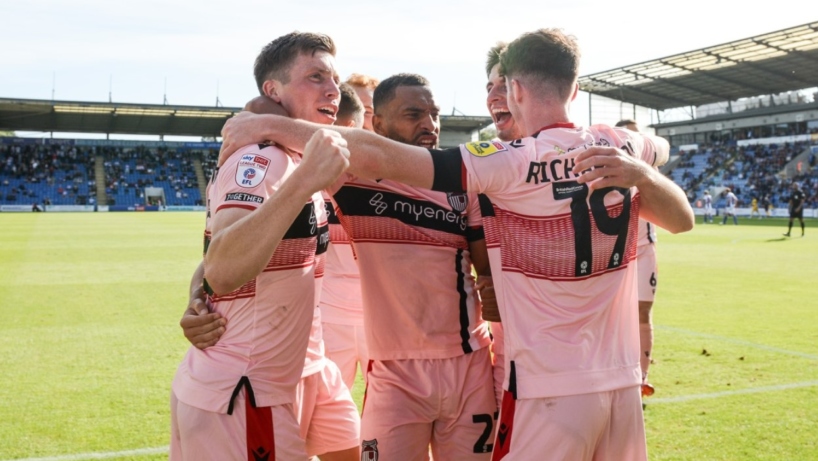 Players celebrating Harry Clifton's goal at Colchester