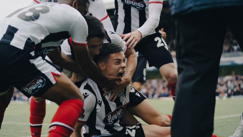 Alex Hunt celebrates scoring against Barnet